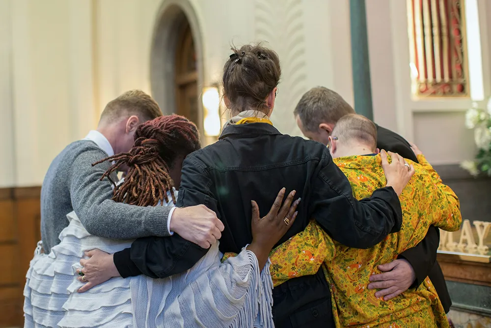large group of people praying