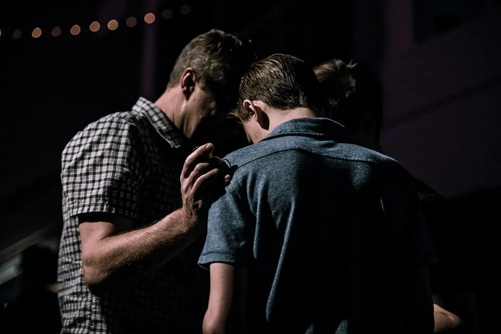 Several people praying together