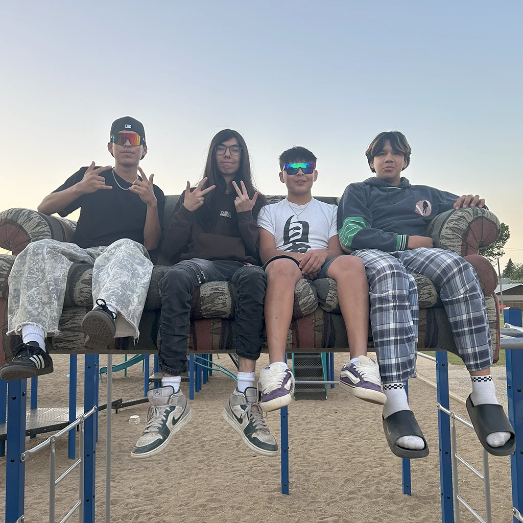 Boys on a couch outside